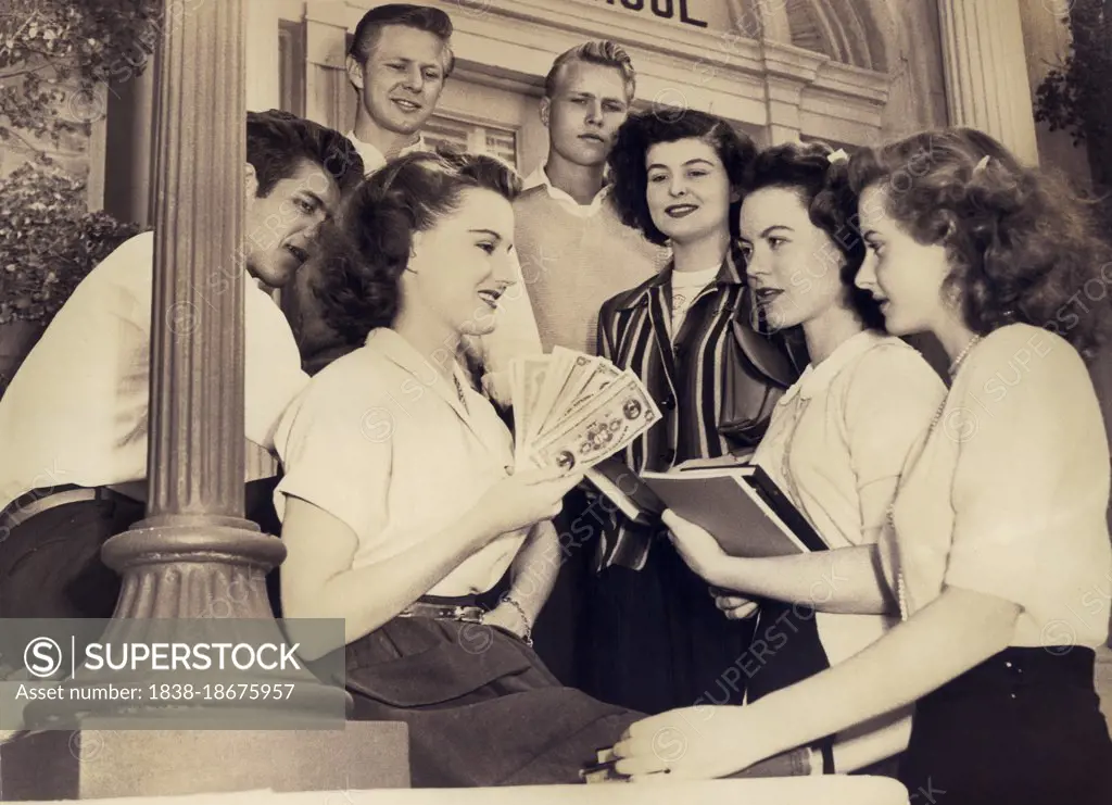 Danny Sue Nolan (left  holding money), on-set of the Film, "Flame of Youth", Republic Pictures, 1949