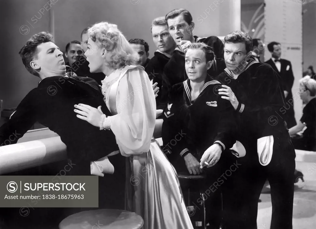 Eddie Bracken (left), Betty Hutton, William Holden (right, back), on-set of the Film, "The Fleet's In", Paramount Pictures, 1942