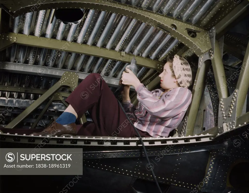 Woman riveting A-20 Bomber, Douglas Aircraft Company, Long Beach, California, USA, Alfred T. Palmer, U.S. Office of War Information, October 1942