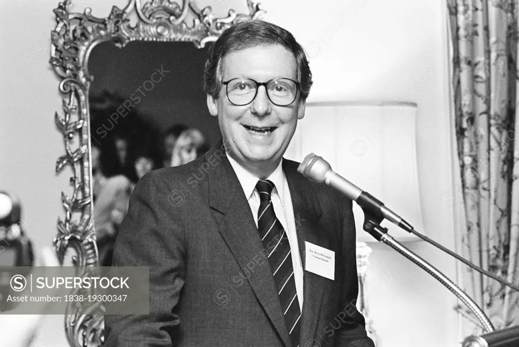 U.S. Senator from Kentucky Mitch McConnell, half-length portrait speaking at microphone at gathering of Republican Party women candidates, Washington, D.C., USA, Laura Patterson, Roll Call Photograph Collection, June 1992