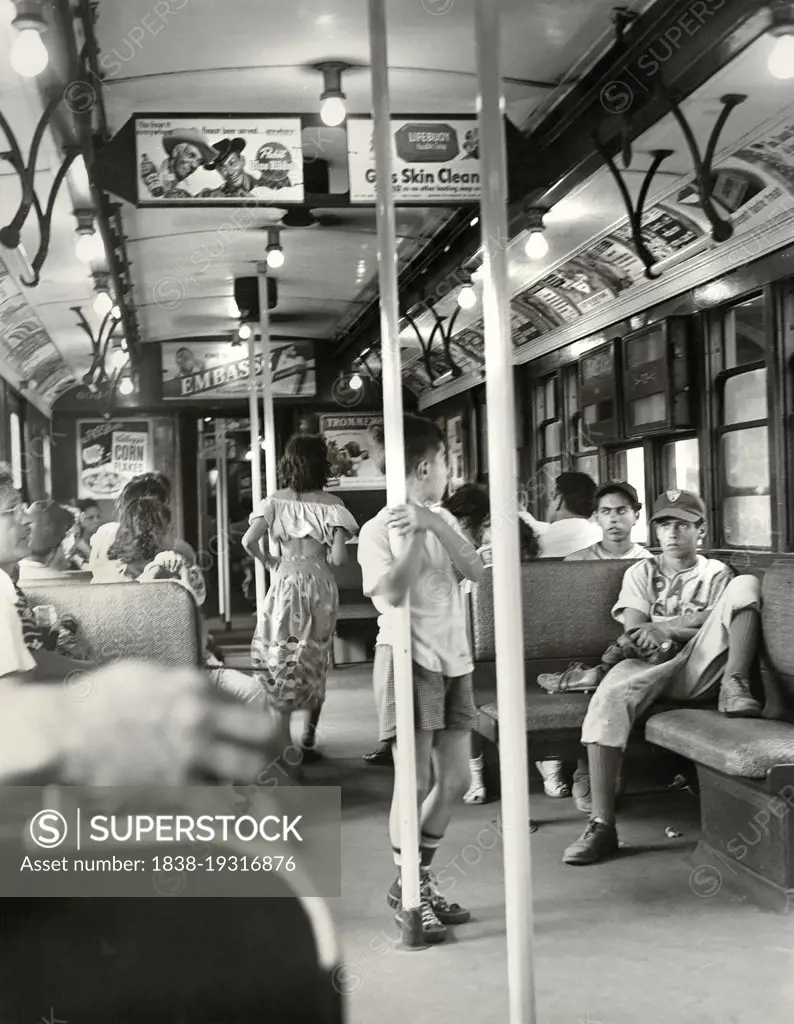 Passengers on Subway, Young Boy holding onto Pole, Brooklyn, New York City, New York, USA, Angelo Rizzuto, Anthony Angel Collection, June 1949