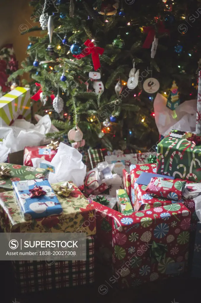 Wrapped Gifts by Christmas Tree Decorated with Ornaments