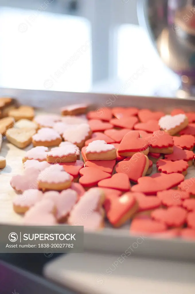 Red and Pink Heart-Shaped Cookies on Baking Sheet