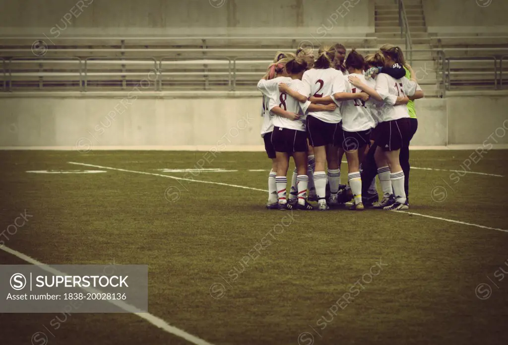 Girls Soccer Team in Huddle