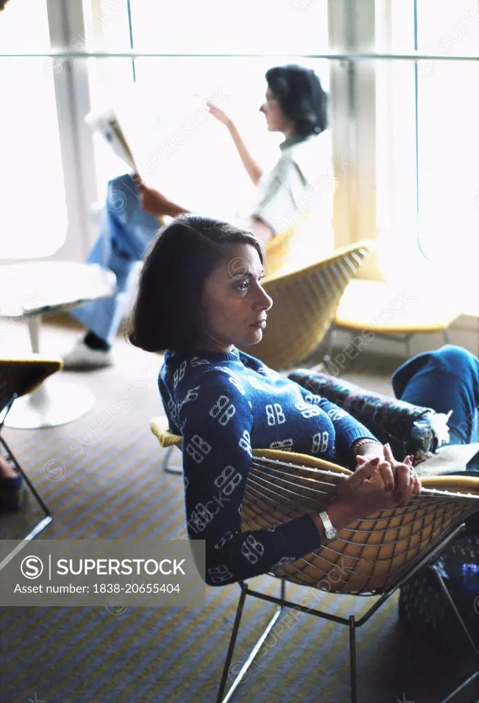 Profile of Mid-Adult Woman Sitting in Café on Cruise Ship, circa 1970's