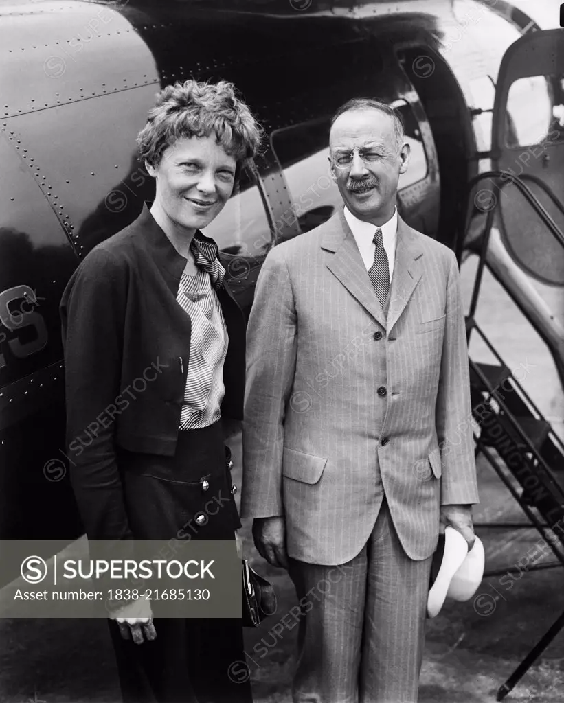 Amelia Earhart (L), Portrait with Man in front of Airplane, Harris & Ewing, 1932