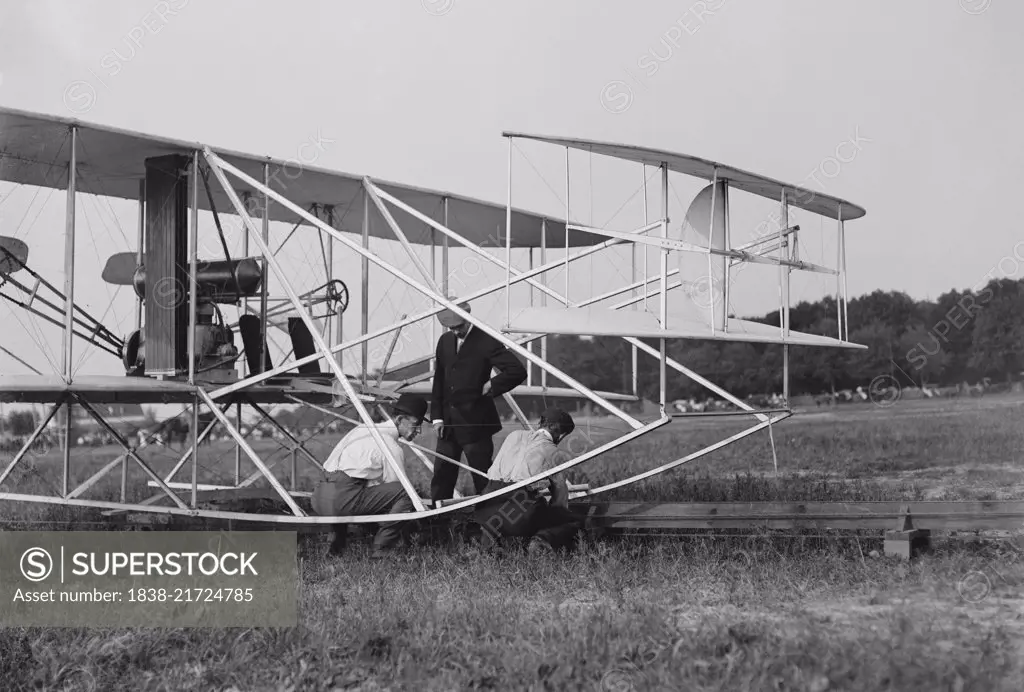 Wilbur and Orville Wright, Charlie Taylor Putting Airplane on Launching Rail, First Army Flights, Fort Myer, Virginia, USA, Harris & Ewing, July 1909