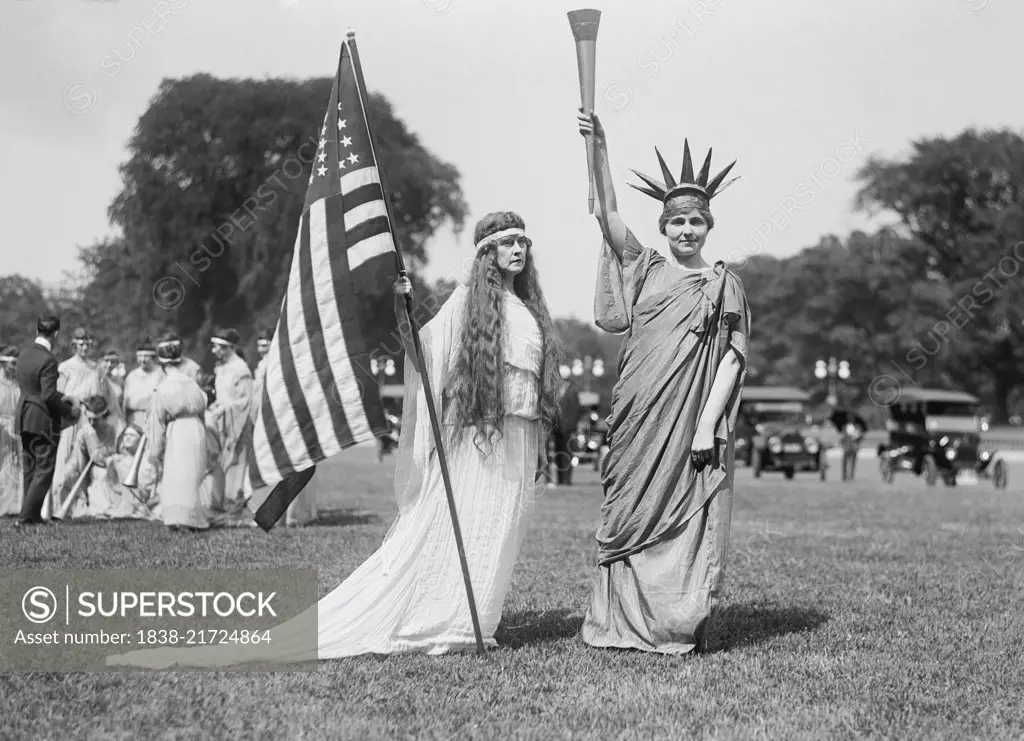 Woman with American Flag and Women in Statue of Liberty Costume, Fourth of July Celebration, the Ellipse, Washington DC, USA, Harris & Ewing, 1919