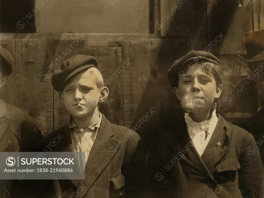 Two Young Newsboys Smoking, Half-Length Portrait, St. Louis, Missouri, USA, Lewis Hine for National Child Labor Committee, May 1910