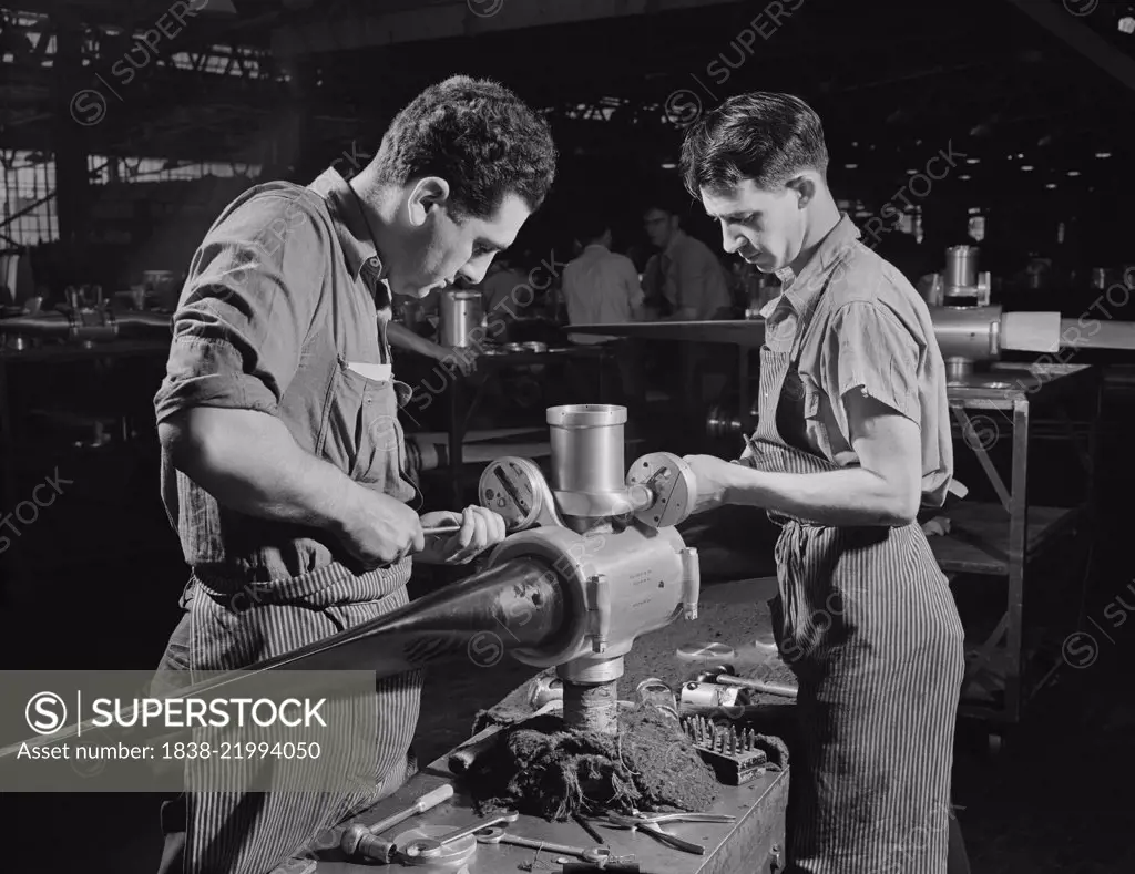 Leo Diana and George O'Meara working Assembling Propeller Blade for Military Aircraft at Manufacturing Plant, Hartford, Connecticut, USA, Andreas Feininger for Office of War Information, June 1942