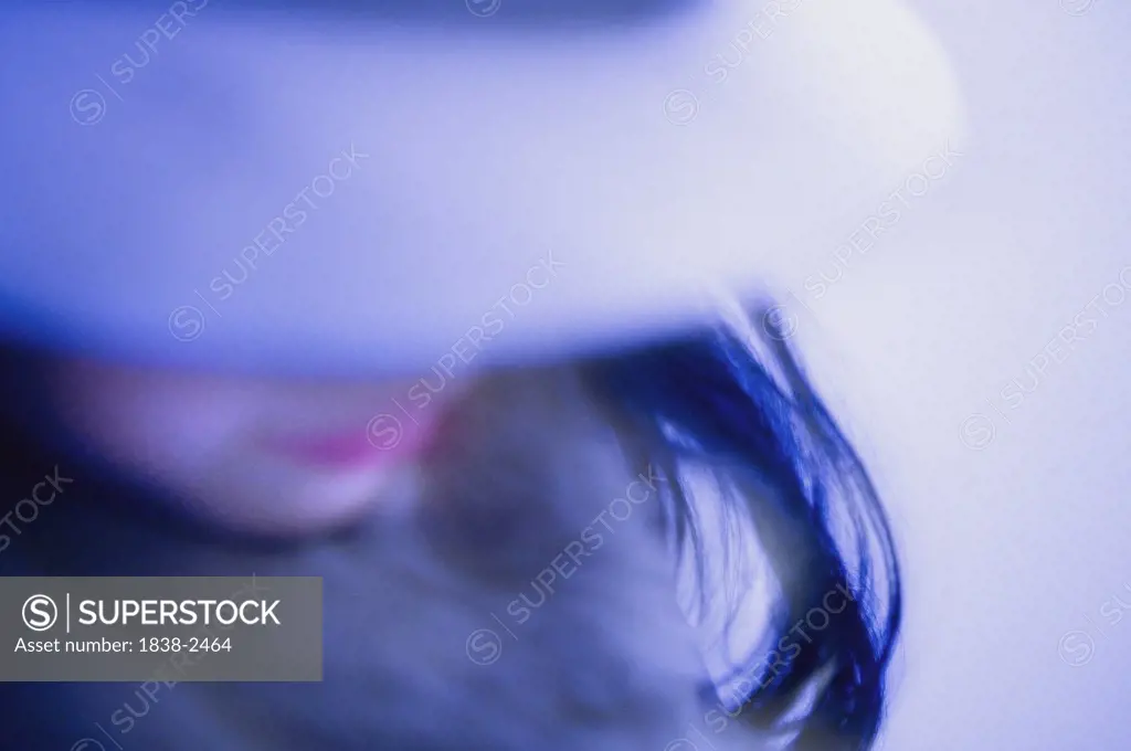 Blurry Blue Girl Wearing Hat