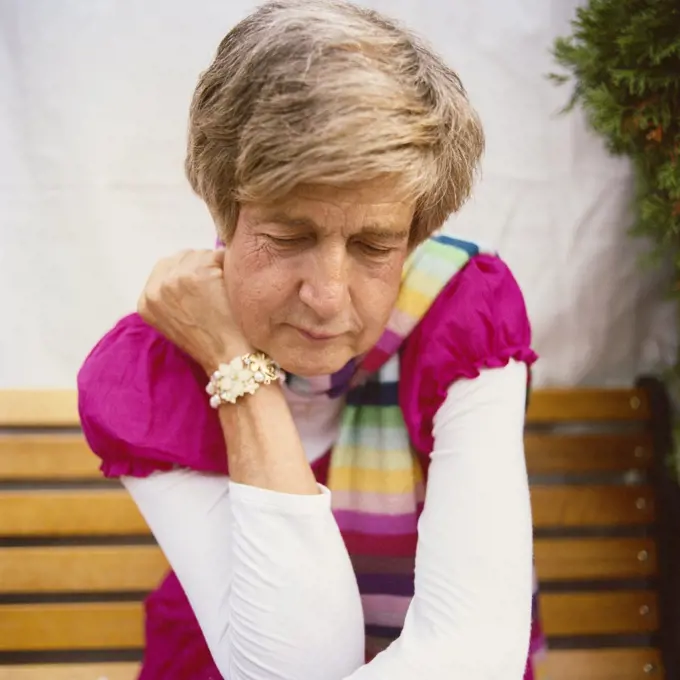 Portrait of Mid-Adult Man with Pink Top and Bracelet