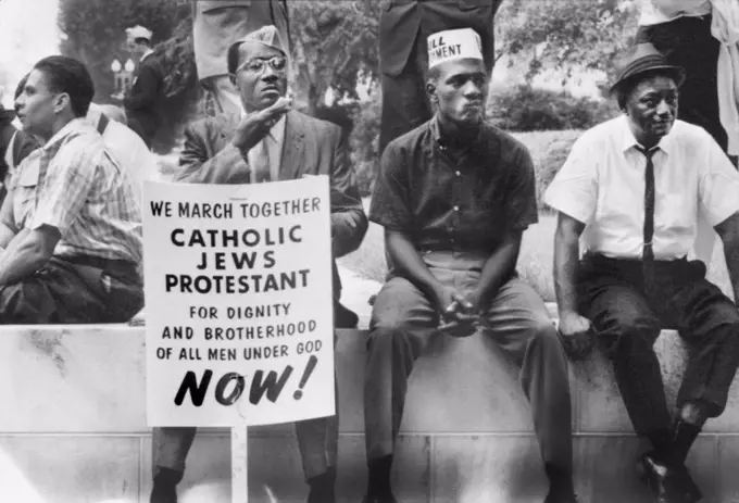 Participants in Selma to Montgomery Civil Rights March resting on Wall, Alabama, USA, Peter Pettus, March 1965