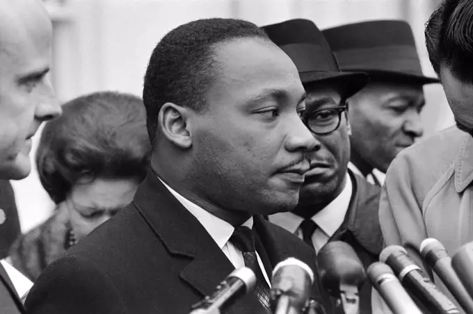 Martin Luther King, Jr., at Microphones, after meeting with President Lyndon Johnson to discuss Civil Rights, at White House, Washington, D.C. USA, Warren K. Leffler, December 3, 1963