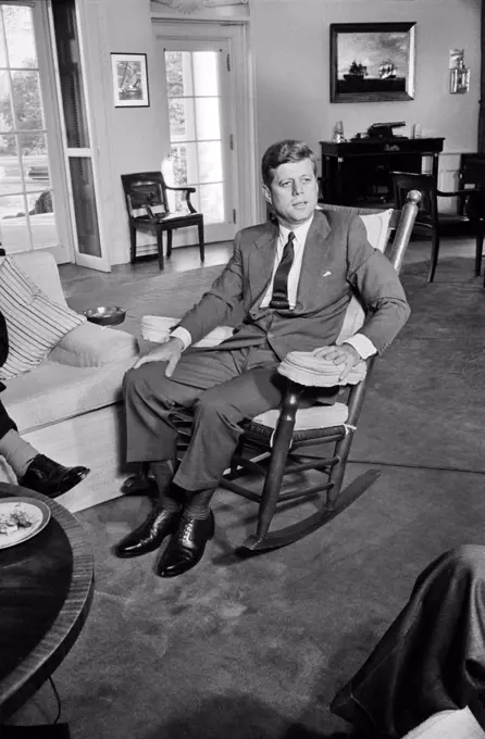 U.S. President John Kennedy, seated portrait in Rocking Chair, White House, Washington, D.C., USA, Warren K. Leffler, October 24, 1962