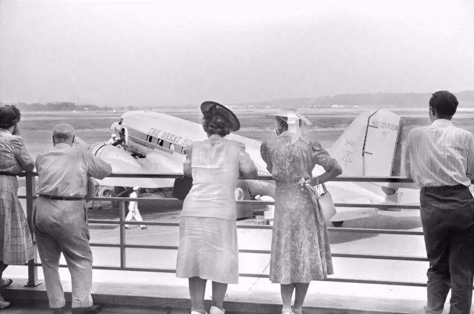 Visitors watching Airplane from Observation Platform, Municipal Airport, Washington, D.C., USA, Jack Delano, U.S. Office of War Information, July 1941