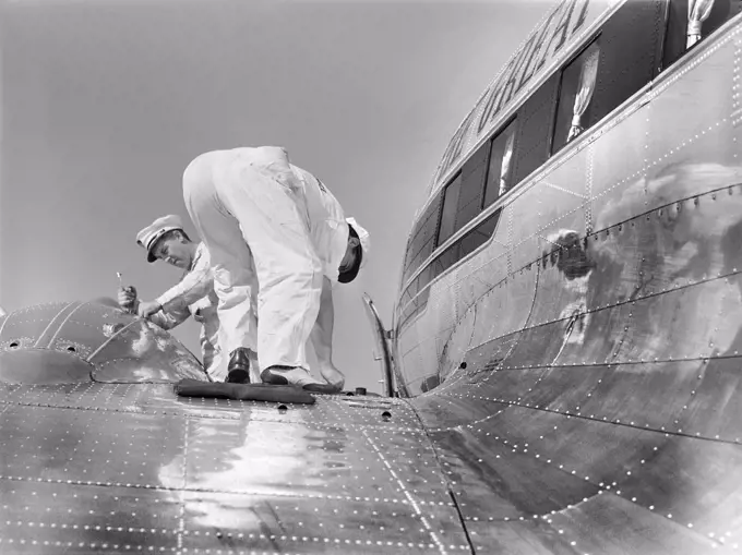 Mechanics checking fuel of Airliner, Municipal Airport, Washington, D.C., USA, Jack Delano, U.S. Office of War Information, July 1941