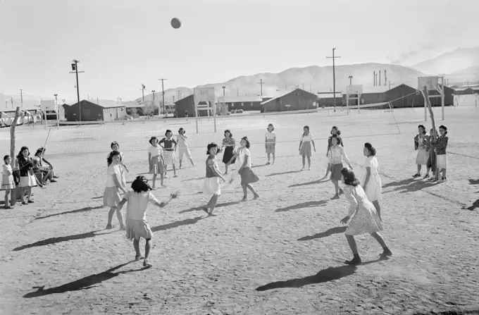 Japanese-American Girls playing Volleyball, Manzanar Relocation Center, California, USA, Ansel Adams, Manzanar War Relocation Center Collection, 1943