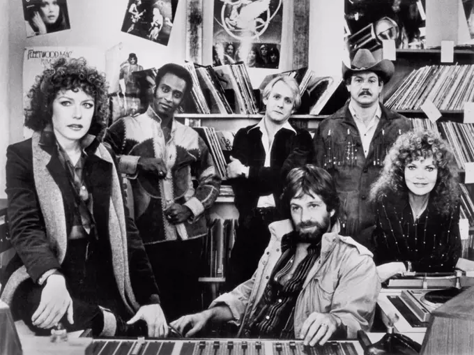 (l-r) Cassie Yates, Cleavon Little, Martin Mull, Alex Karras, Eileen Brennan, Michael Brandon (seated), on-set of Film, "FM", Universal Pictures, 1978