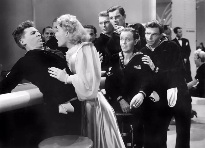 Eddie Bracken (left), Betty Hutton, William Holden (right, back), on-set of the Film, "The Fleet's In", Paramount Pictures, 1942