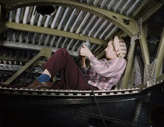 Woman riveting A-20 Bomber, Douglas Aircraft Company, Long Beach, California, USA, Alfred T. Palmer, U.S. Office of War Information, October 1942