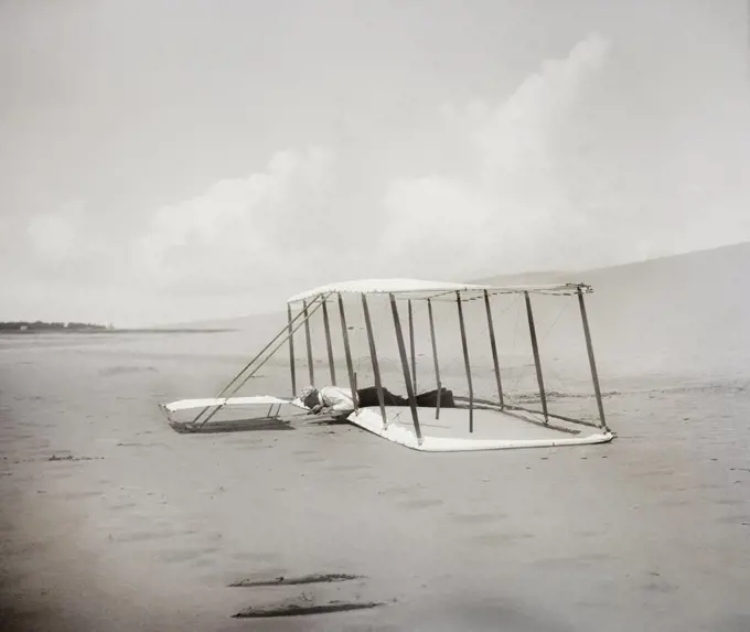 Wilbur Wright in prone position on glider just after landing, Kitty Hawk, North Carolina, USA, Wilber Wright, Orville Wright, 1901