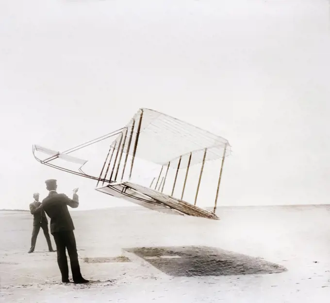 Side view of glider flying as kite near ground, Wilbur at left, Orville at right, Kitty Hawk, North Carolina, USA, Wilber Wright, Orville Wright, 1901