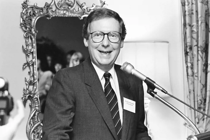 U.S. Senator from Kentucky Mitch McConnell, half-length portrait speaking at microphone at gathering of Republican Party women candidates, Washington, D.C., USA, Laura Patterson, Roll Call Photograph Collection, June 1992