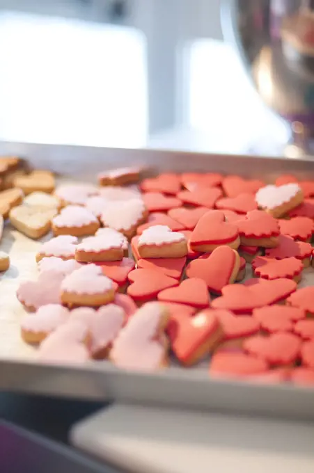 Red and Pink Heart-Shaped Cookies on Baking Sheet