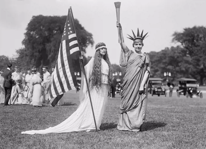 Woman with American Flag and Women in Statue of Liberty Costume, Fourth of July Celebration, the Ellipse, Washington DC, USA, Harris & Ewing, 1919