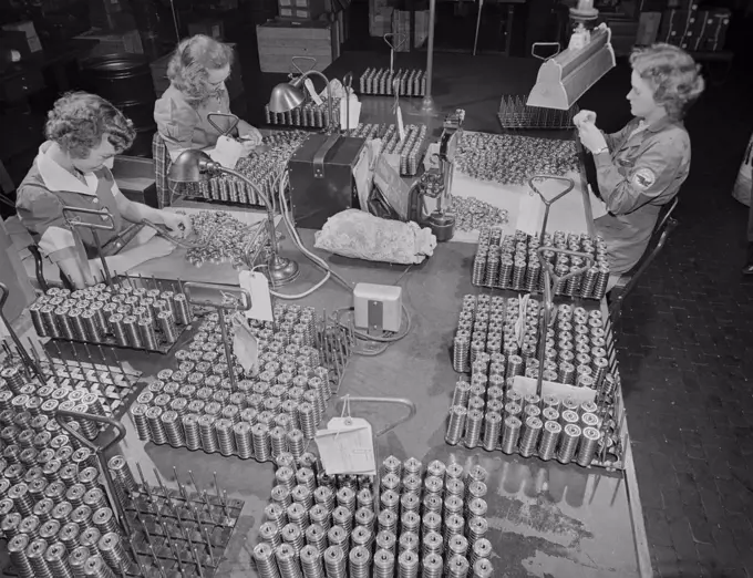 Three Female Workers Inspecting Tappet Rollers for Airplane Motors at Manufacturing Plant, Pratt & Whitney, East Hartford, Connecticut, USA, Andreas Feininger for Office of War Information, June 1942