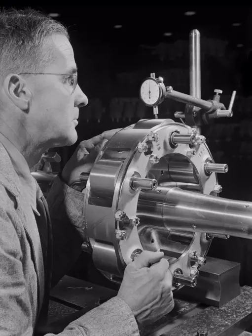 Worker Carefully Checking an Airplane Propeller Shaft for Concentricity at Manufacturing Plant, Pratt & Whitney, East Hartford, Connecticut, USA, Andreas Feininger for Office of War Information, June 1942