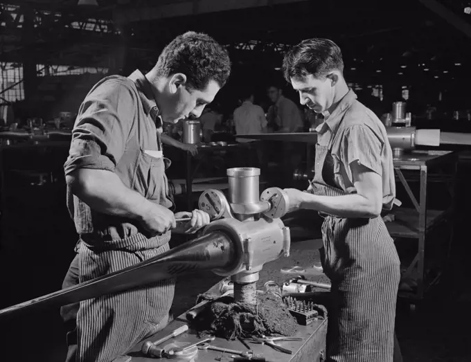 Leo Diana and George O'Meara working Assembling Propeller Blade for Military Aircraft at Manufacturing Plant, Hartford, Connecticut, USA, Andreas Feininger for Office of War Information, June 1942