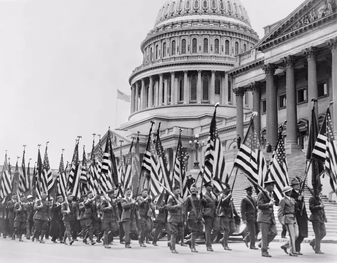 Bonus Expeditionary Forces, many Carrying American Flags, Marching across East Plaza of U.S. Capitol during Bonus Demonstration as Congress Struggled with Deficit, Washington DC, USA, Underwood and Underwood, April 8, 1932