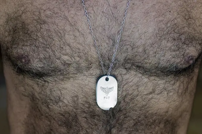 Man Wearing Military Dogtag