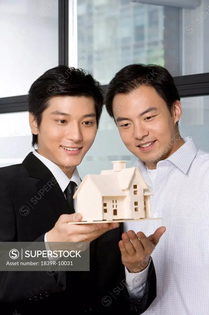 Real estate agent selling a house to customer