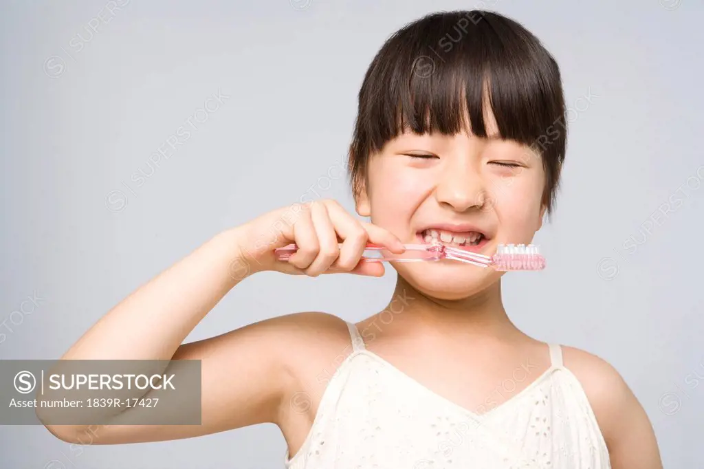 Little girl brushing teeth