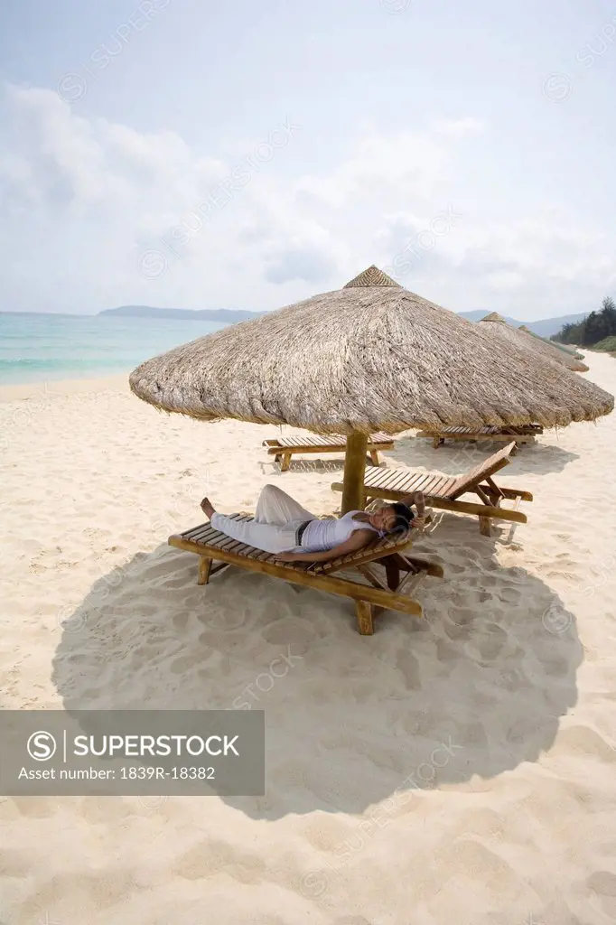 Young woman relaxing on the beach