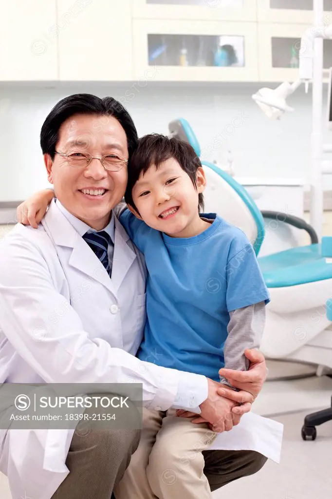 Dentist and little patient in dental clinic