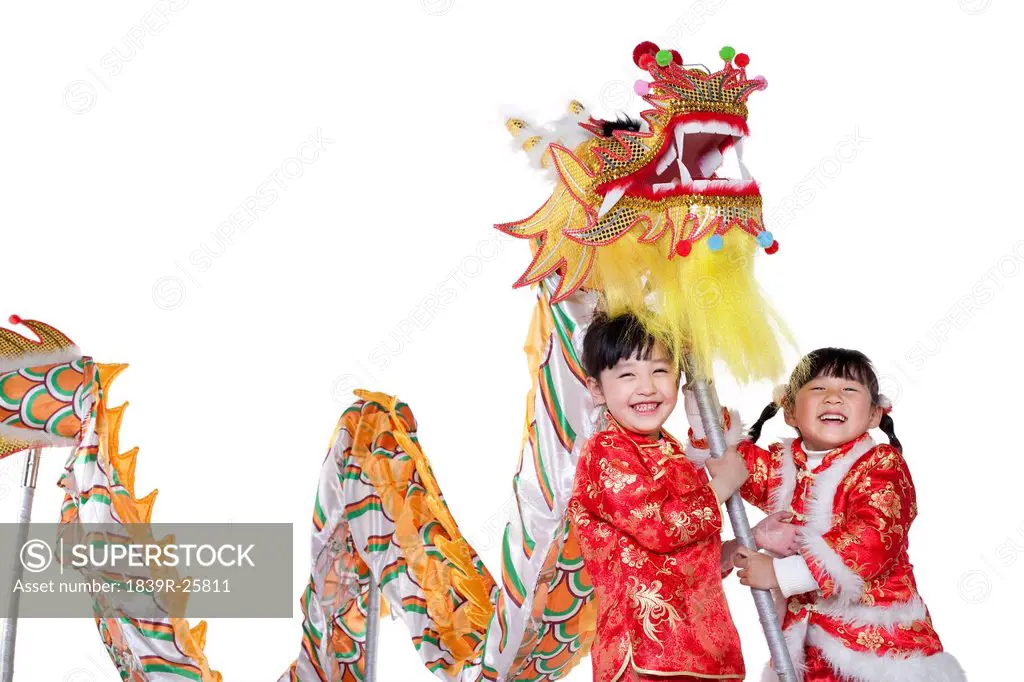 Two Chinese girls holding Chinese dragon