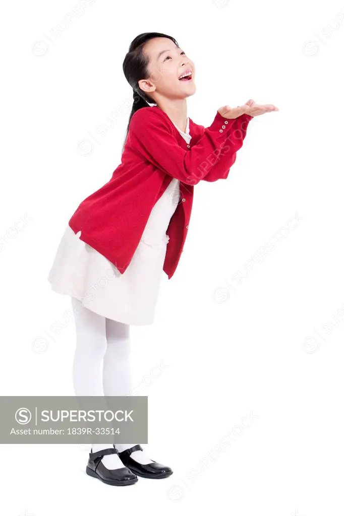 Joyful little girl smiling with hand extension