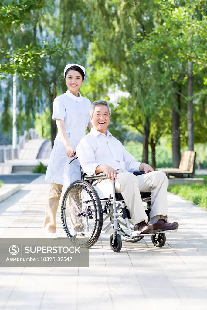 Nurse with wheelchair bound patient