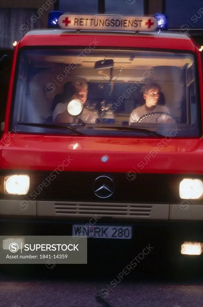 Two men sitting in ambulance