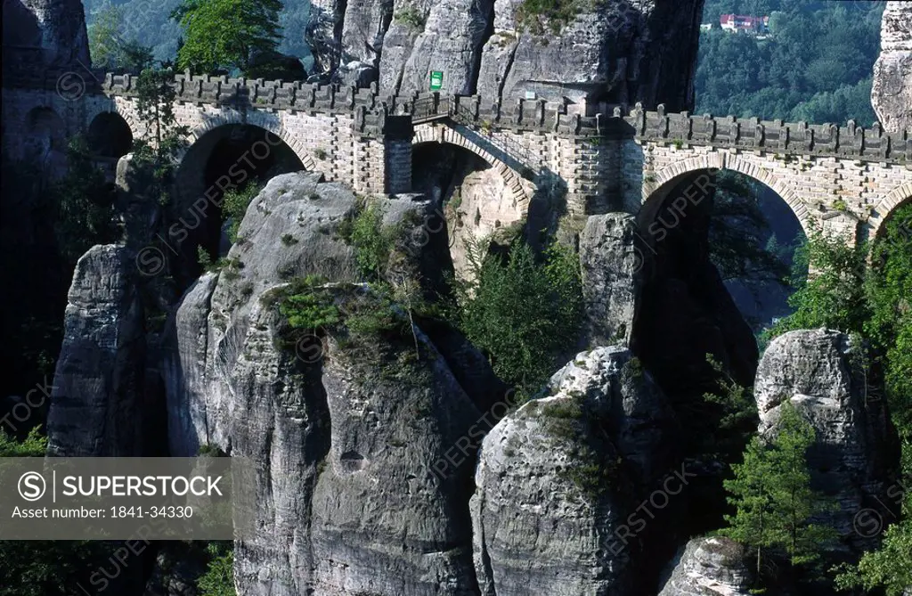 Bridge passing through cliffs, Bastei Bridge, Saxon Switzerland National Park, Dresden, Saxony, Germany