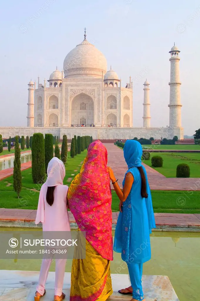 Three women in front of the Taj Mahal, India