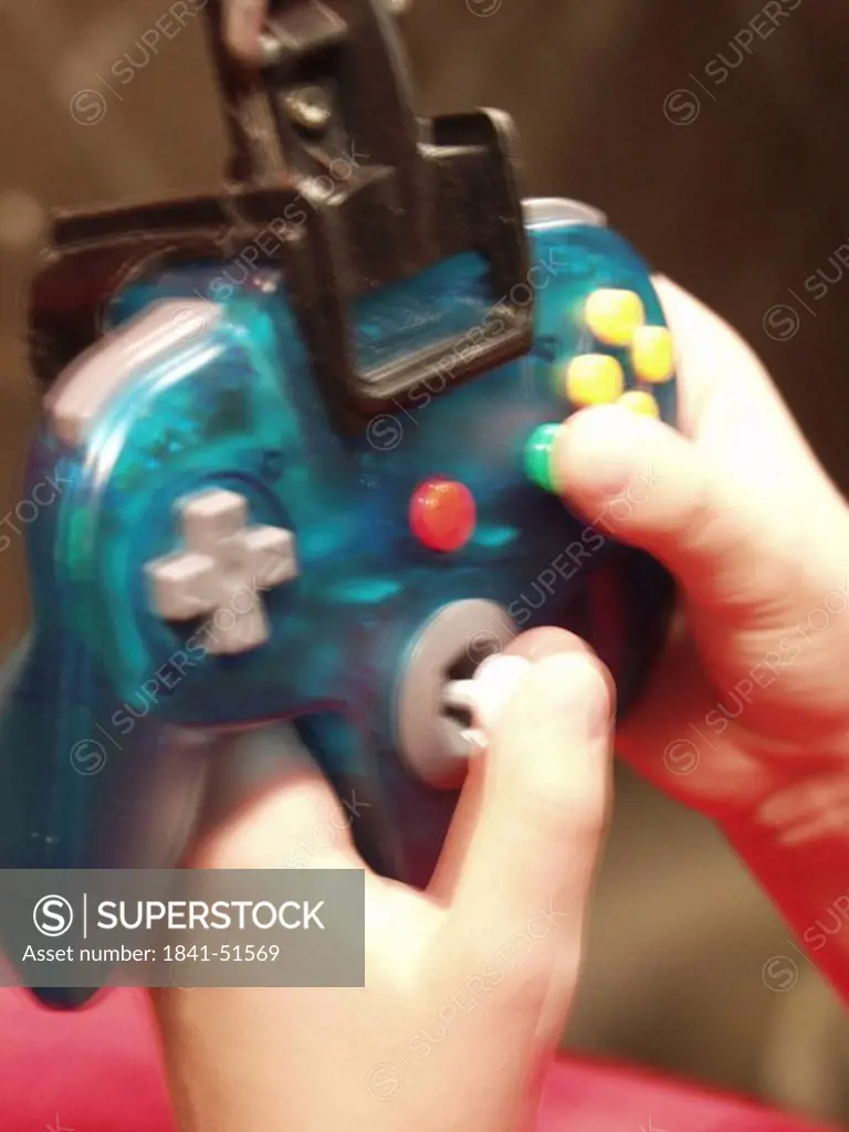 Close_up of person´s hand holding joystick