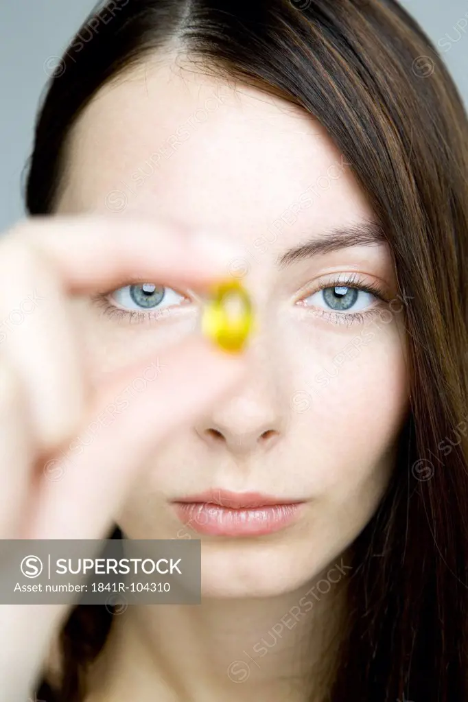 young woman taking medicine