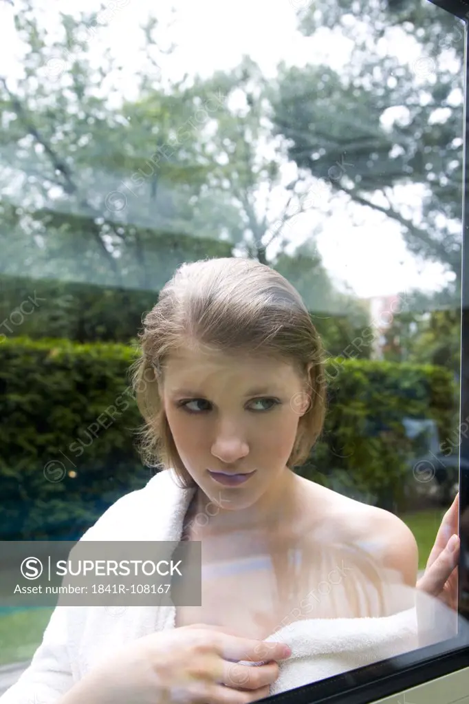 Woman behind window glass