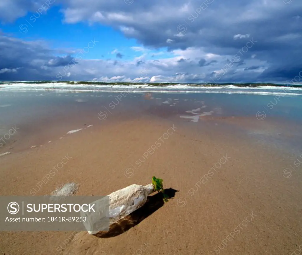 Empty bottle on beach