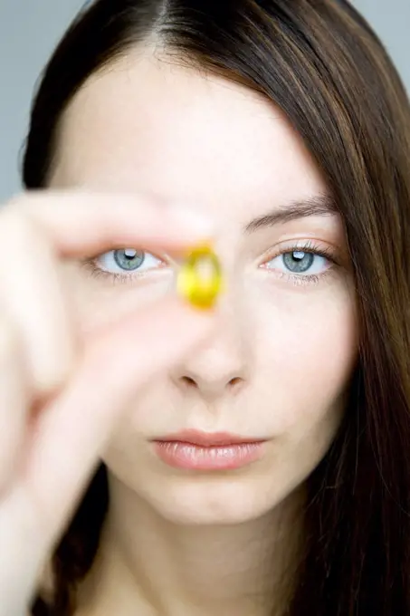 young woman taking medicine